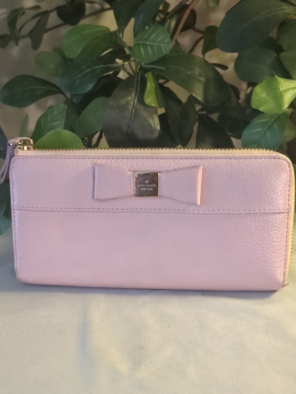 kate spade light pink bow zip-around wallet
